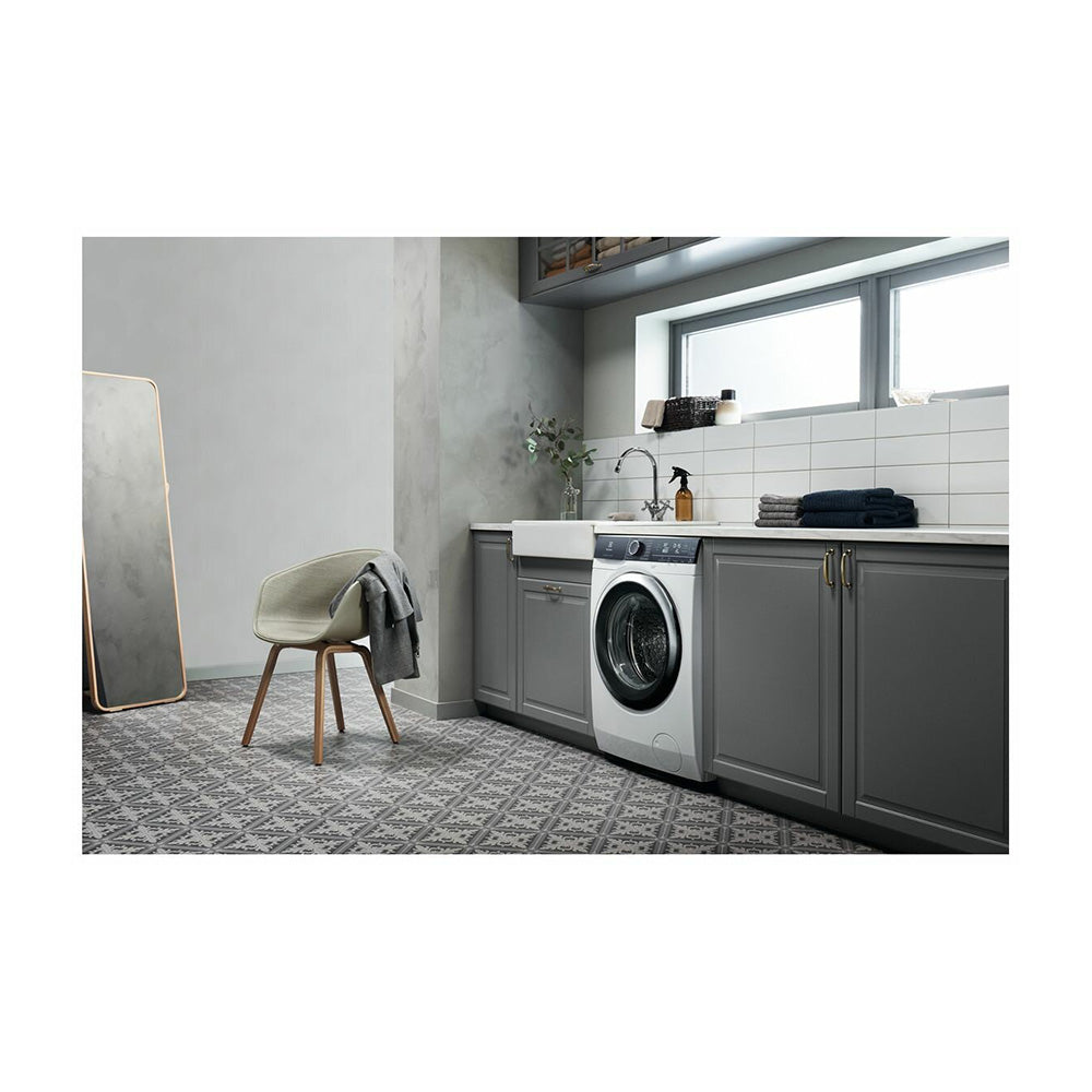 Electrolux 10kg front load washer EWF1042BDWA, Front left view in laundry room