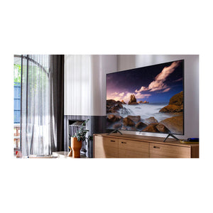 Samsung QA55Q60TAWXXY Q60 Series 55 Inch 4K QLED Smart TV, Front view on a cabinet