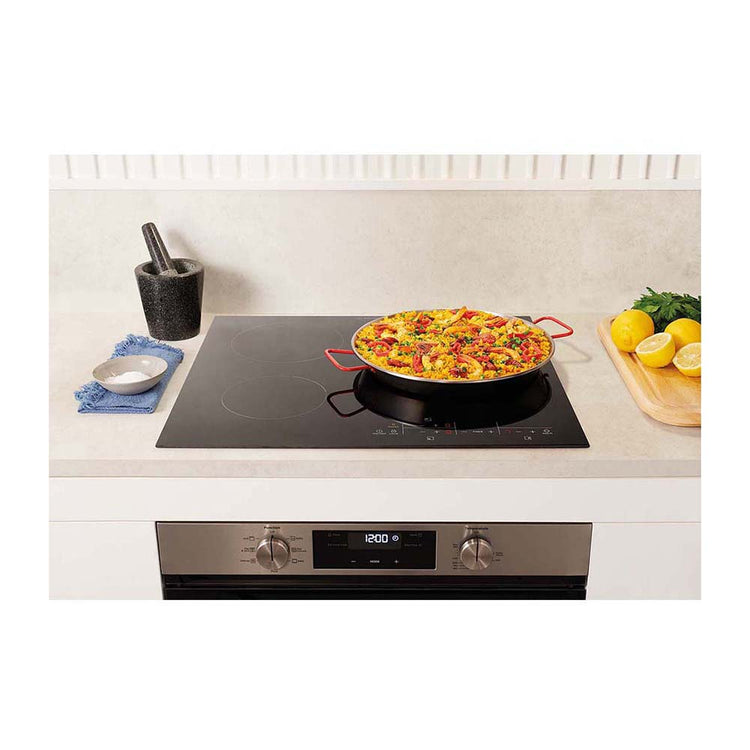 Westinghouse WHC633BC 60cm 3 Zone Ceramic Cooktop w/Maxi Zone, Front top view with food dish on cooktop